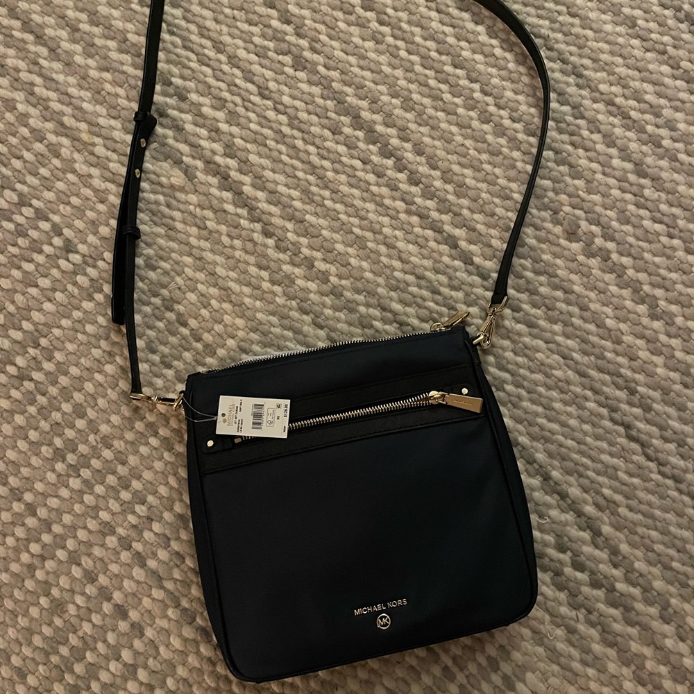 Brand new royal blue vinyl Michael Kors Crossbody.